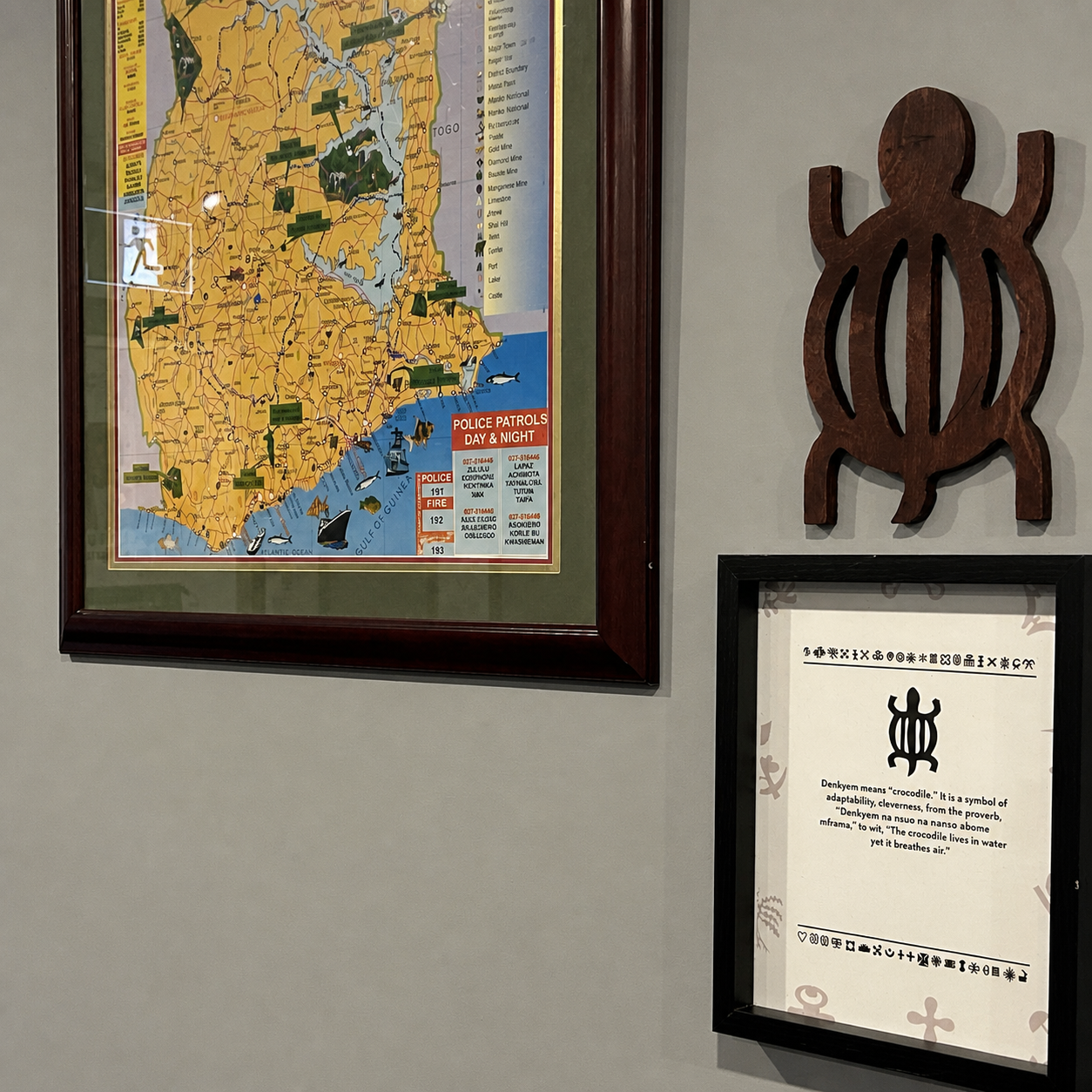 Ghanaian Adinkra wall decor display with a framed map of Ghana